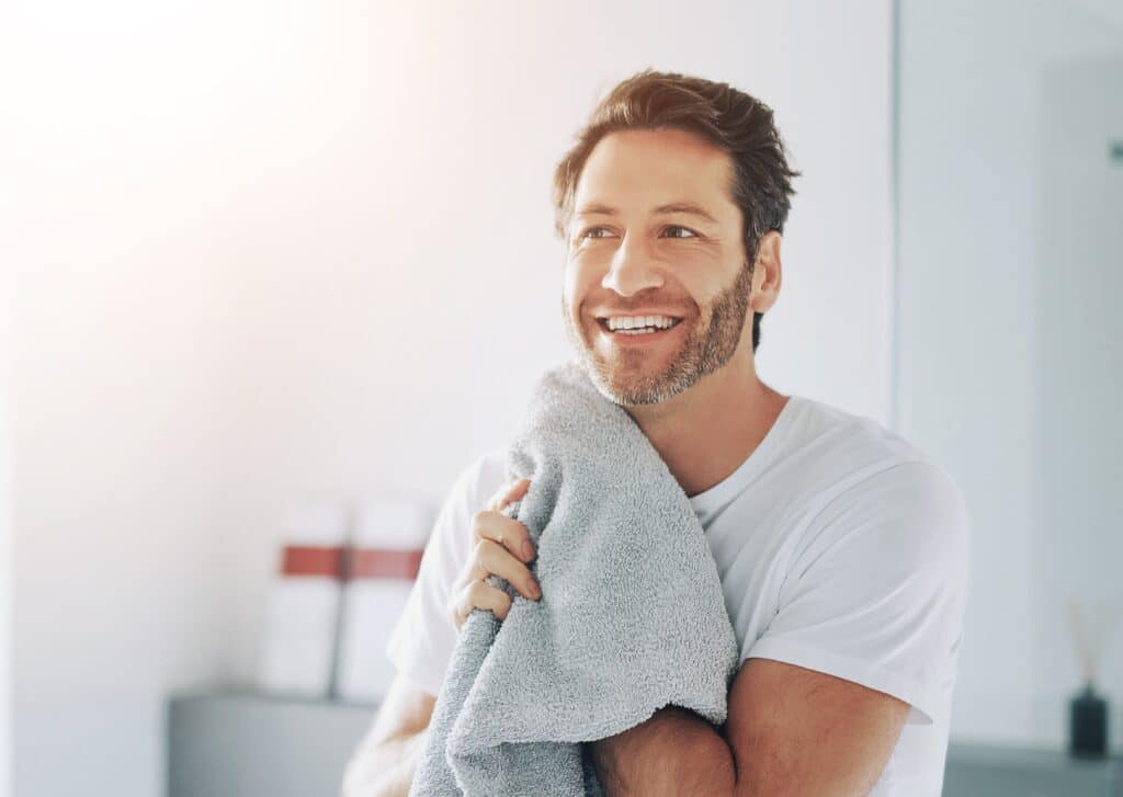Grooming,,Towel,And,Man,In,Bathroom,For,Morning,With,Routine