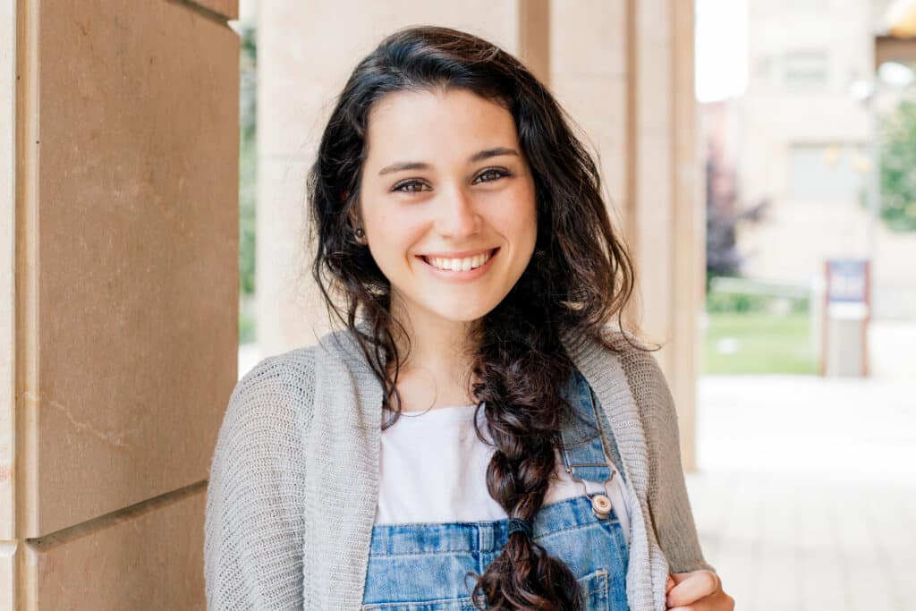 Cute,Student,Girl,With,Braid,Smiling,At,You